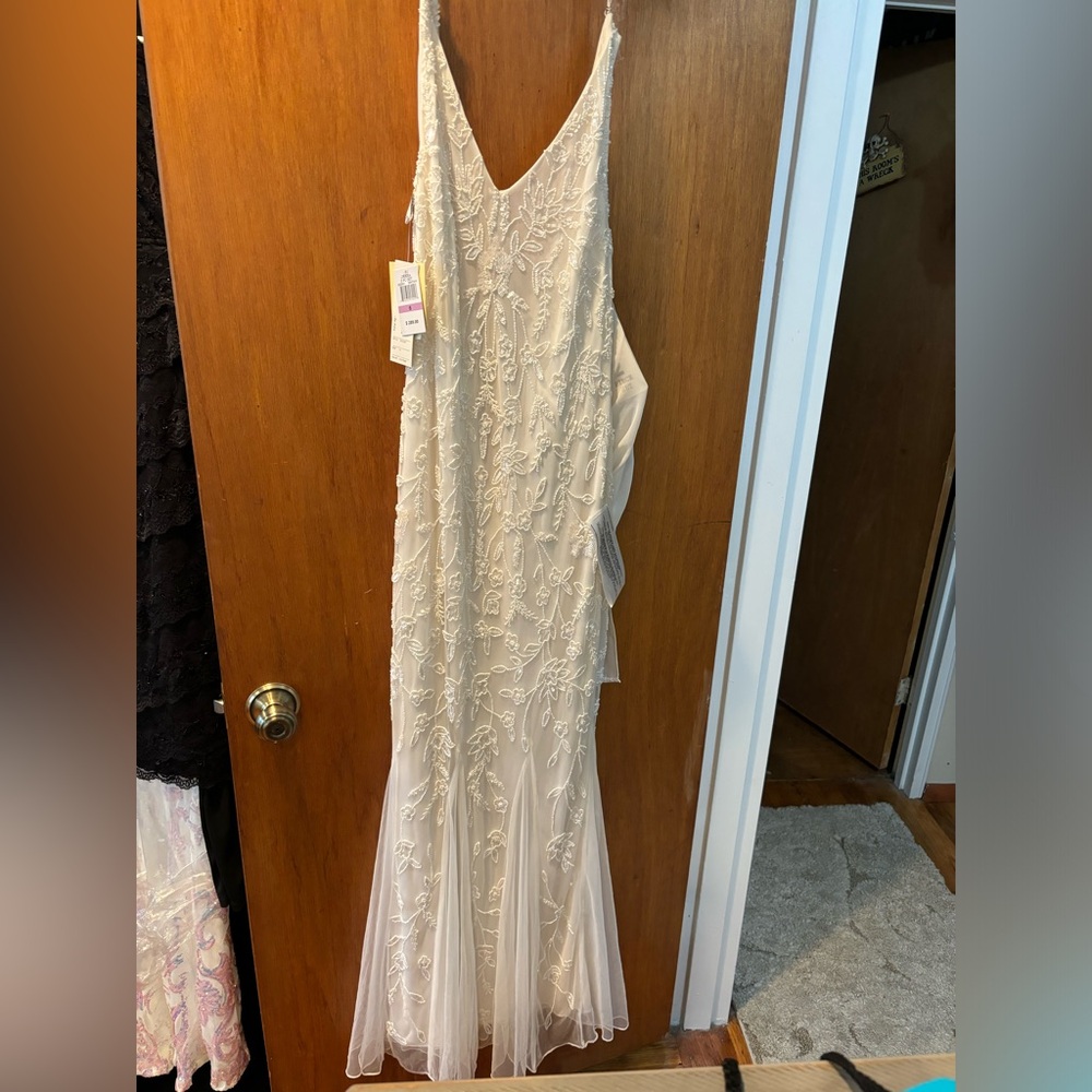 Brand new JKARA wedding dress never worn.  Size 6